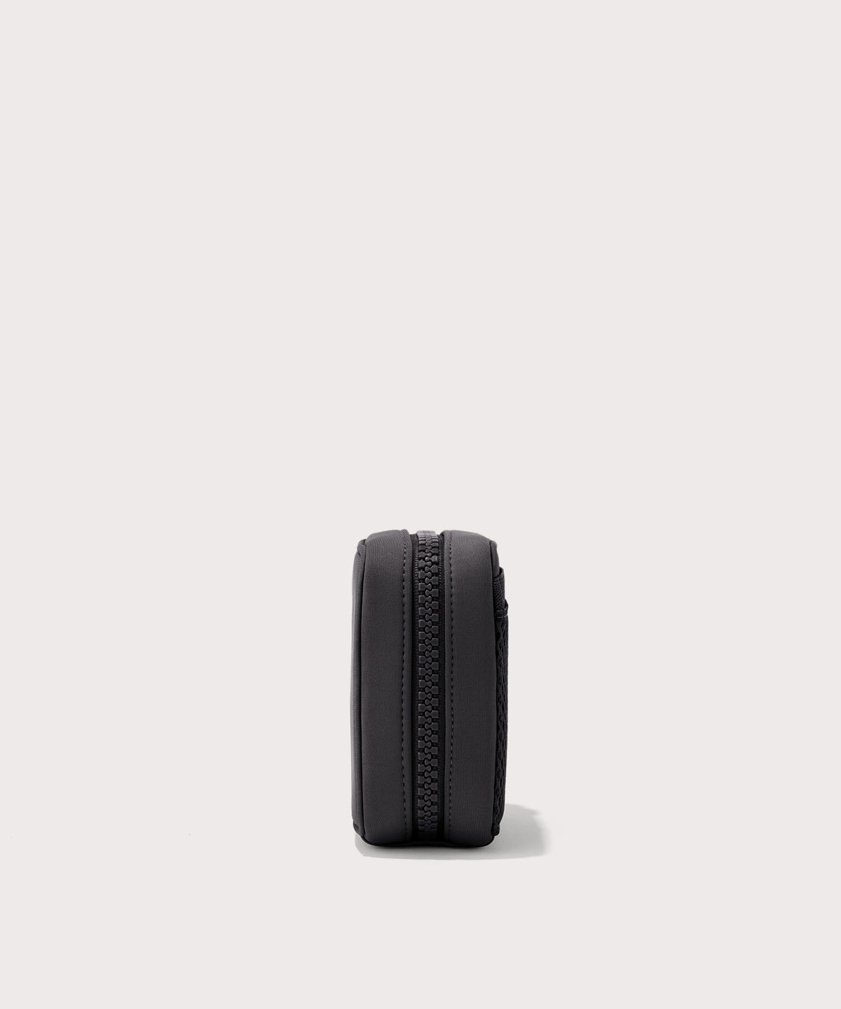 Dagne Dover small Arlo Tech Organizer in black seen from the side.
