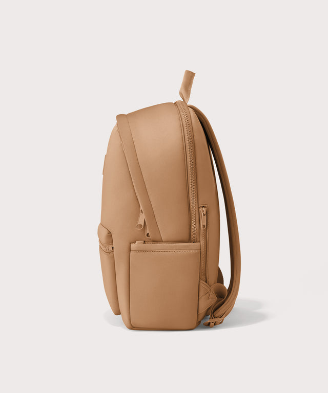 Dagne Dover large Dakota Neoprene Backpack in camel seen from the side.
