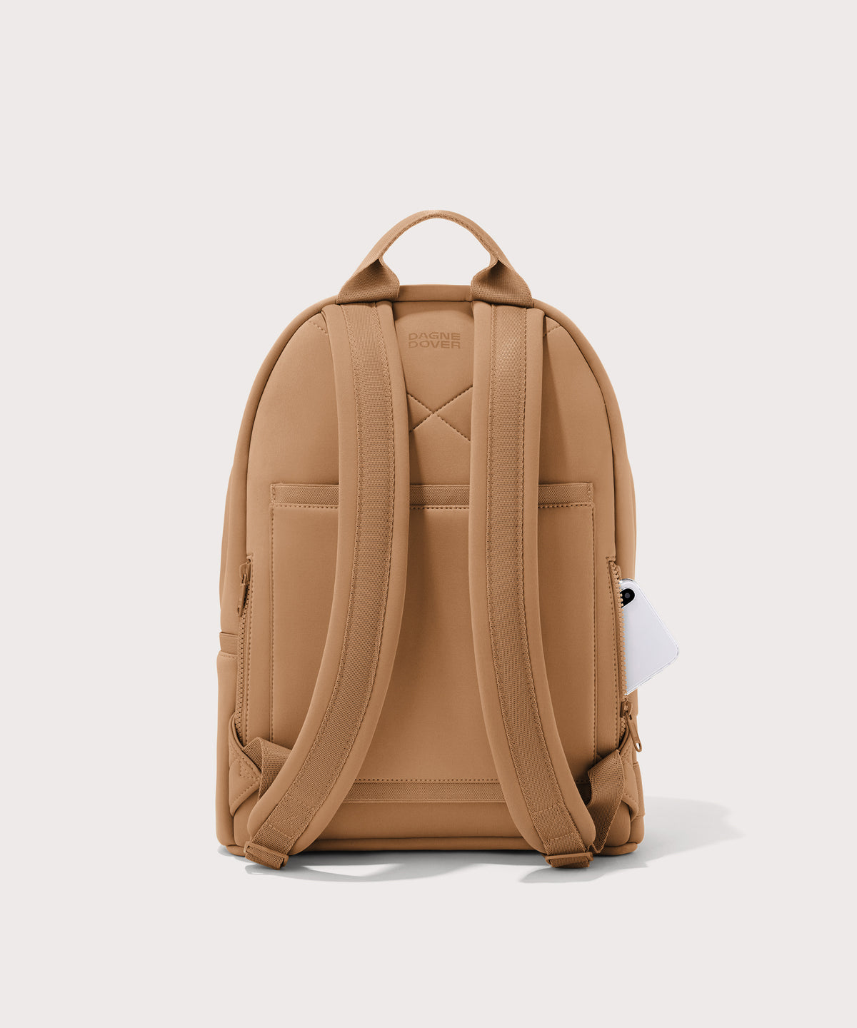 Dagne Dover medium Dakota Neoprene Backpack in camel brown seen from the back.