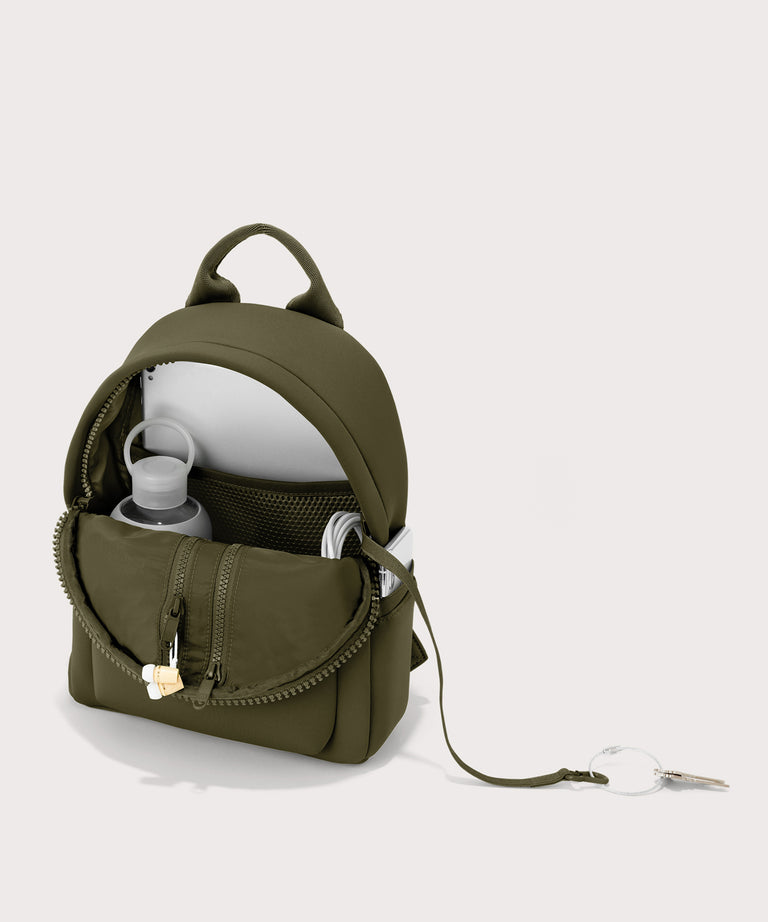 Dagne Dover Dakota Small Neoprene Backpack in dark moss unzipped, revealing the interior air mesh pockets.