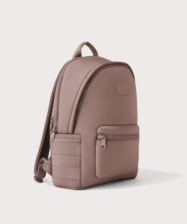 Dagne Dover large Dakota Neoprene Backpack in pink seen from an angle.
