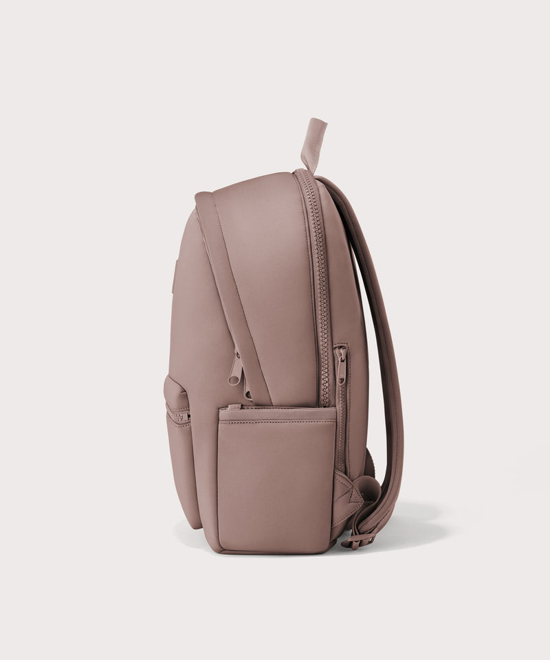 Dagne Dover large Dakota Neoprene Backpack in pink seen from the side.
