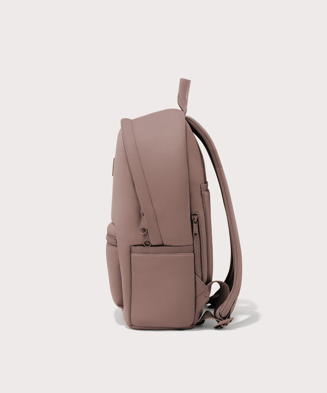 Dagne Dover medium Dakota Neoprene Backpack in pink seen from the side.
