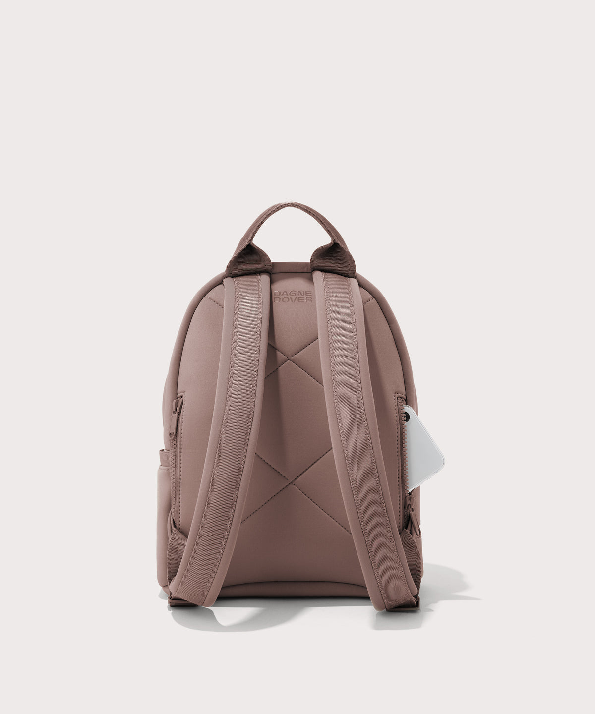 Dagne Dover small Dakota Neoprene Backpack in pink seen from the back.
