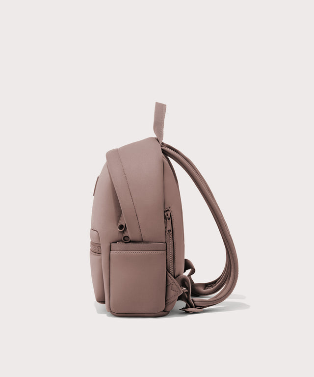 Dagne Dover small Dakota Neoprene Backpack in pink seen from the side.
