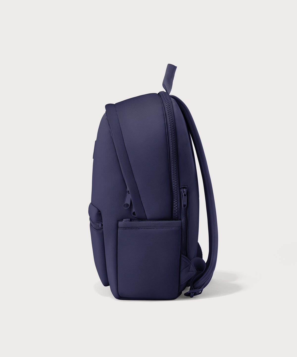 Dagne Dover large Dakota Neoprene Backpack in dark blue seen from the side.
