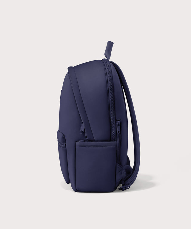 Dagne Dover large Dakota Neoprene Backpack in dark blue seen from the side.
