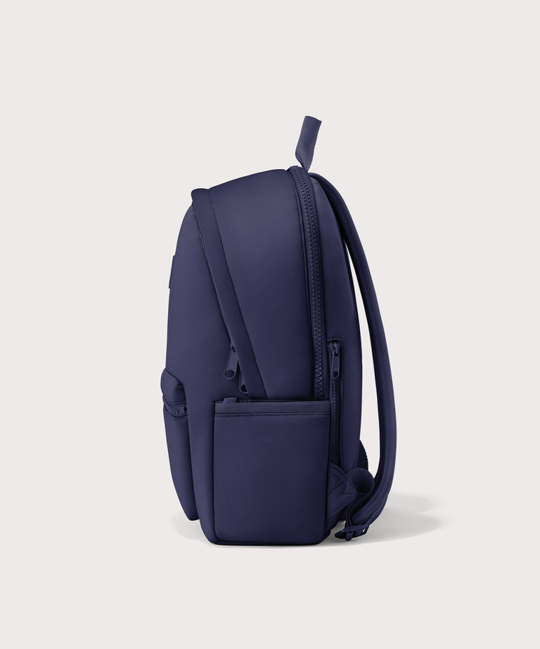 Dagne Dover large Dakota Neoprene Backpack in dark blue seen from the side.
