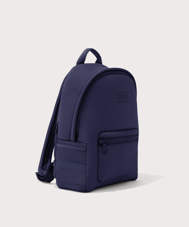 Dagne Dover medium Dakota Neoprene Backpack in dark blue seen from an angle.
