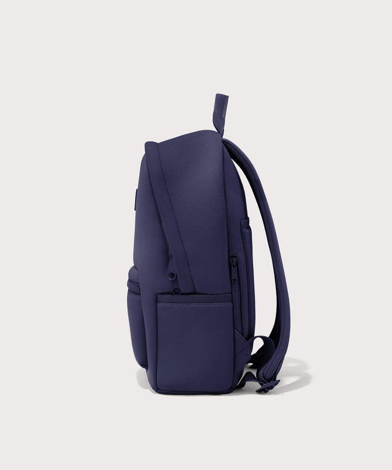 Dagne Dover medium Dakota Neoprene Backpack in dark blue seen from the side.
