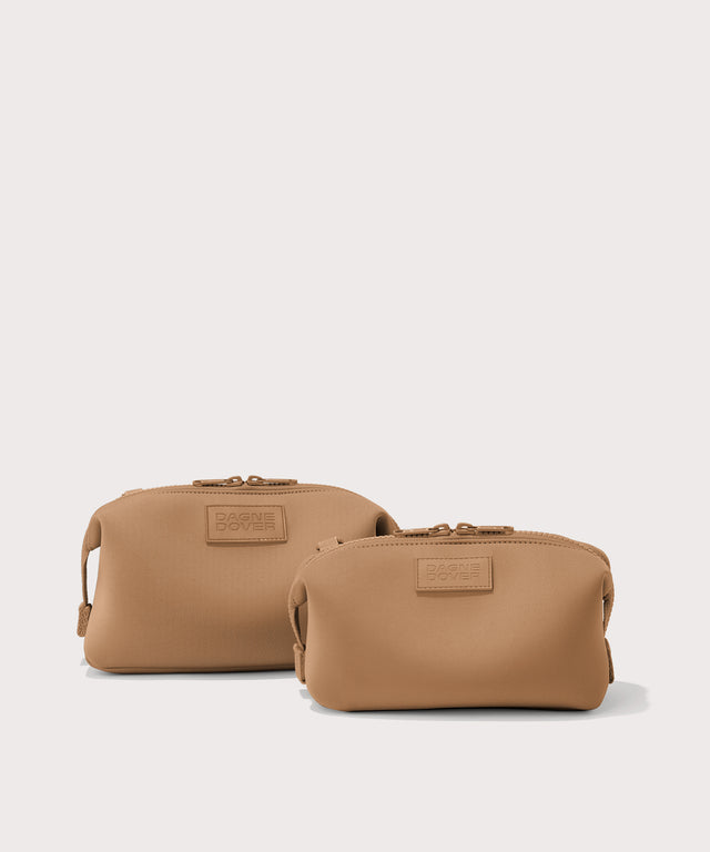 Dagne Dover Small and Large Hunter Toiletry Bags in camel.

