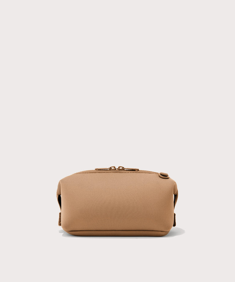 Dagne Dover Small Hunter Toiletry Bag in camel seen from the back.
