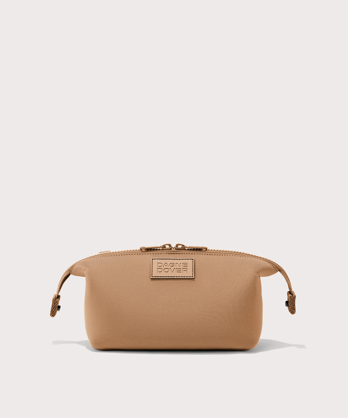 Dagne Dover Small Hunter Toiletry Bag in camel with sides unclipped.
