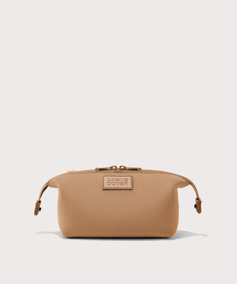 Dagne Dover Small Hunter Toiletry Bag in camel with sides unclipped.
