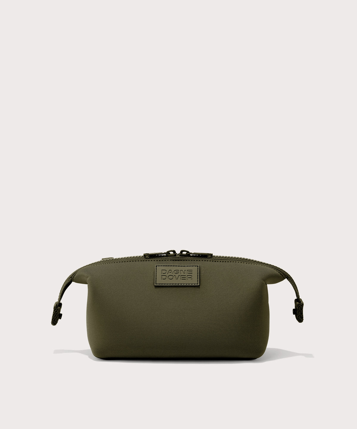Dagne Dover Small Hunter Toiletry Bag in dark moss with sides unclipped.
