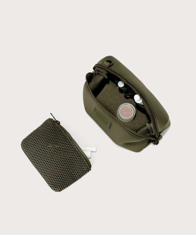 Dagne Dover Small Hunter Toiletry Bag in dark moss unzipped and seen from above with the removable air mesh pouch alongside it.