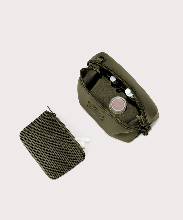Dagne Dover Small Hunter Toiletry Bag in dark moss unzipped and seen from above with the removable air mesh pouch alongside it.