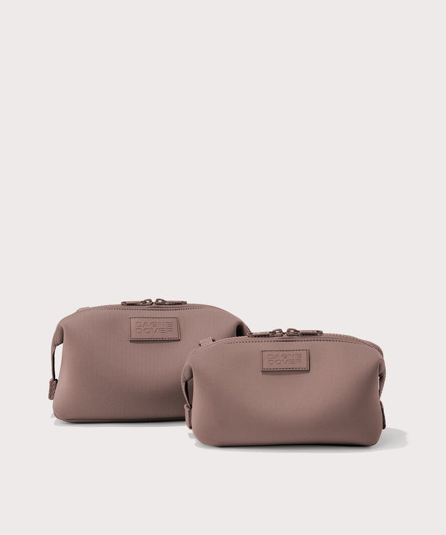 Dagne Dover Small and Large Hunter Toiletry Bags in pink.
