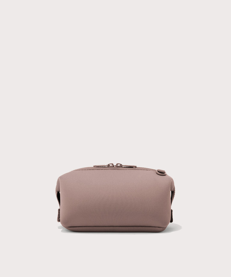 Dagne Dover Small Hunter Toiletry Bag in pink seen from the back.
