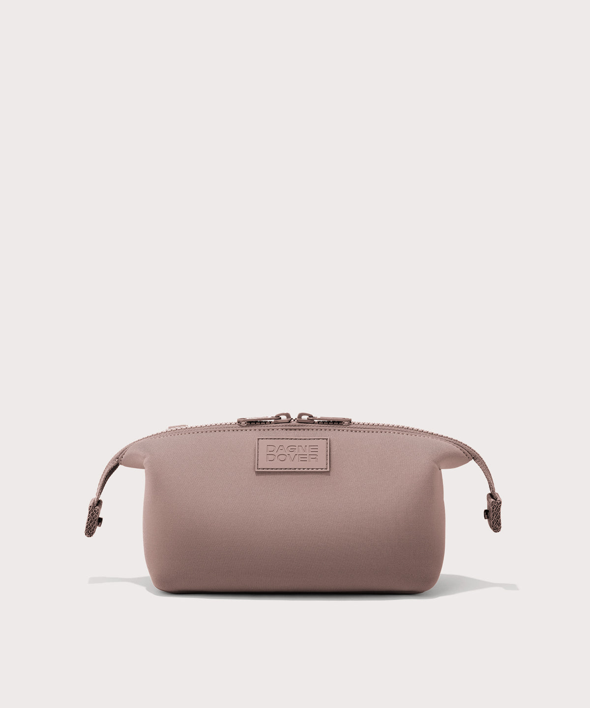 Dagne Dover Small Hunter Toiletry Bag in pink with sides unclipped.
