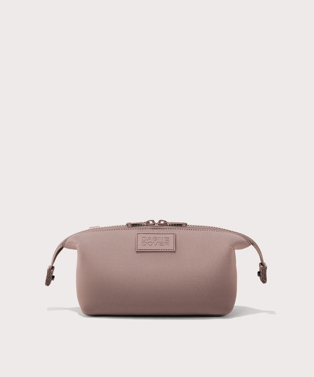Dagne Dover Small Hunter Toiletry Bag in pink with sides unclipped.
