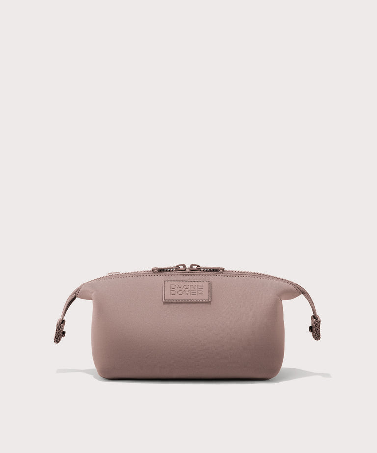 Dagne Dover Small Hunter Toiletry Bag in pink with sides unclipped.
