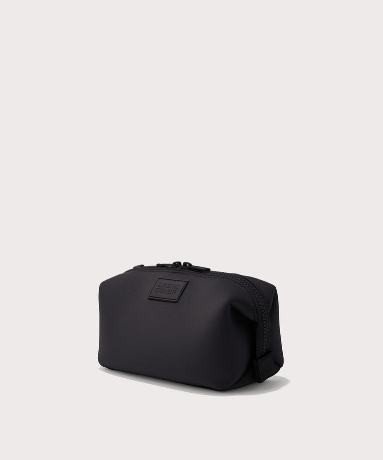 Dagne Dover Small Hunter Toiletry Bag in black seen from an angle.
