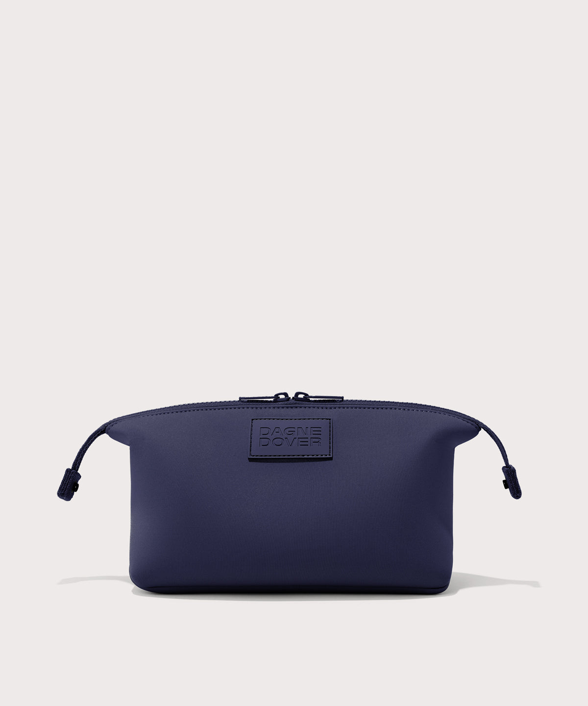 Dagne Dover Large Hunter Toiletry Bag in dark blue with sides unclipped.
