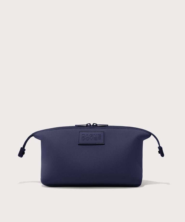 Dagne Dover Large Hunter Toiletry Bag in dark blue with sides unclipped.
