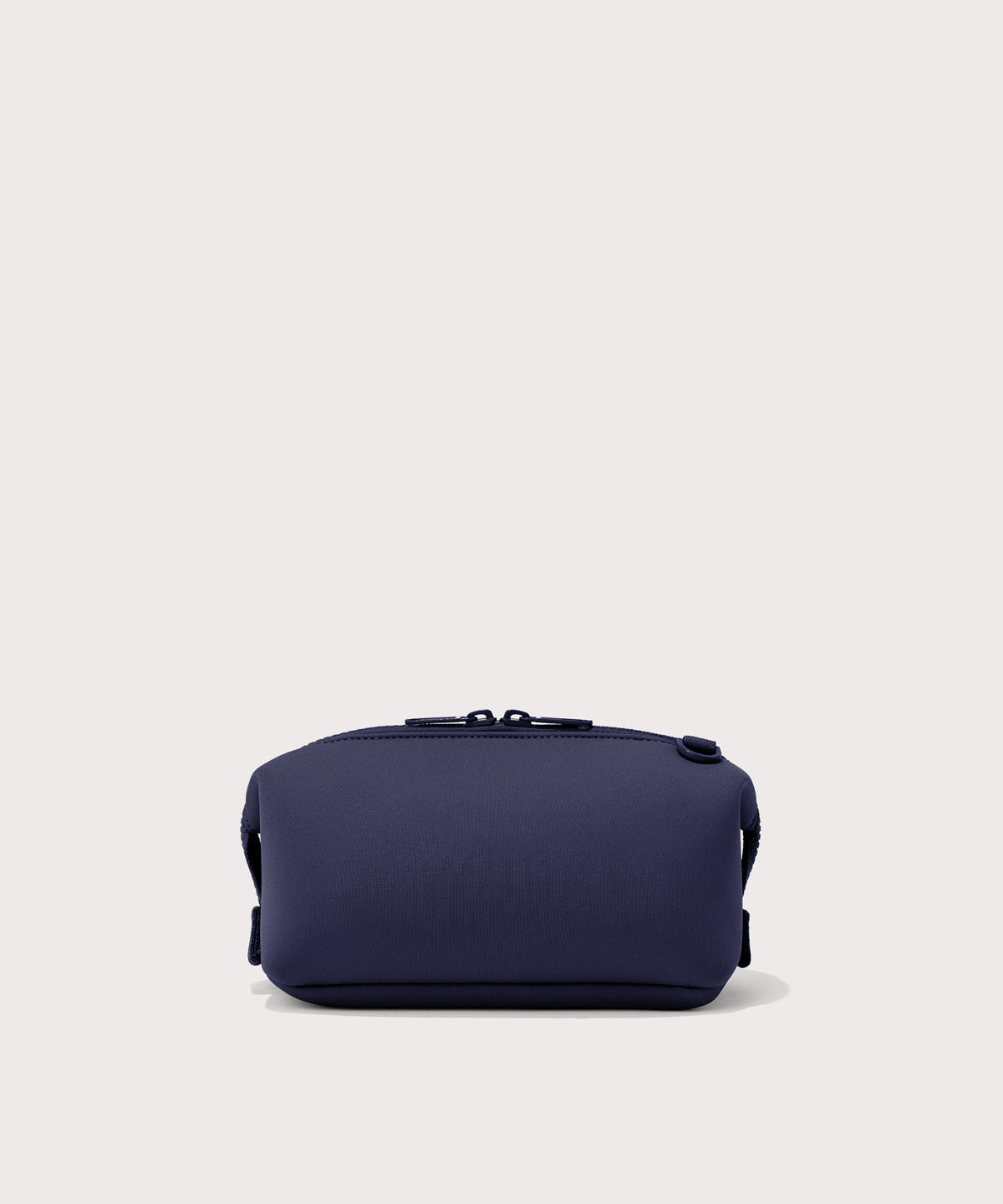 Dagne Dover Small Hunter Toiletry Bag in dark blue seen from the back.
