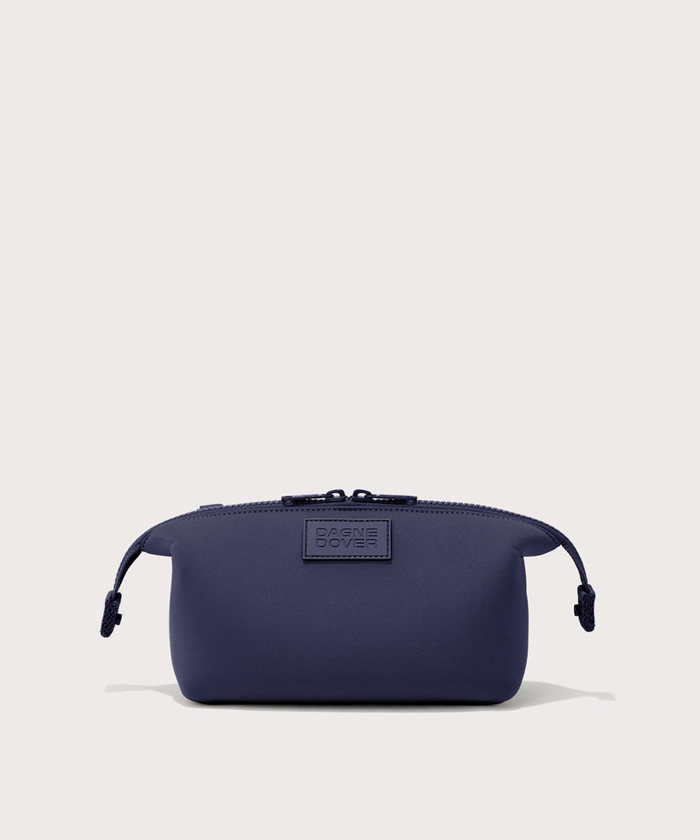 Dagne Dover Small Hunter Toiletry Bag in dark blue with sides unclipped.
