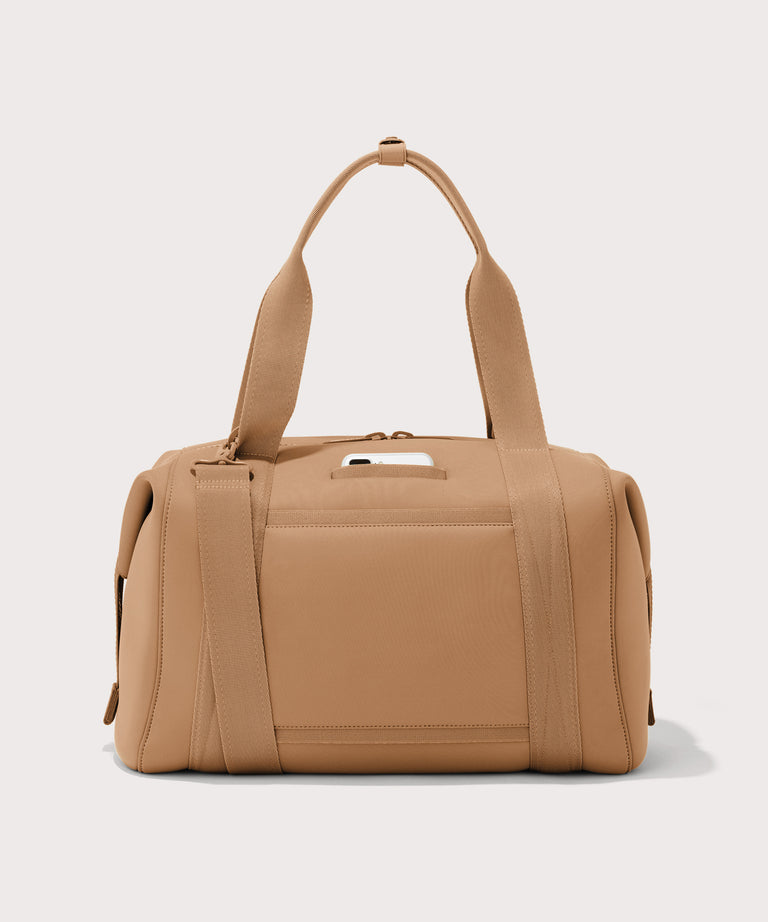Large Landon Carryall in brown camel, displaying an exterior phone pocket
