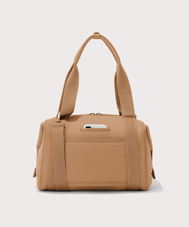 Large Landon Carryall in brown camel, displaying an exterior phone pocket
