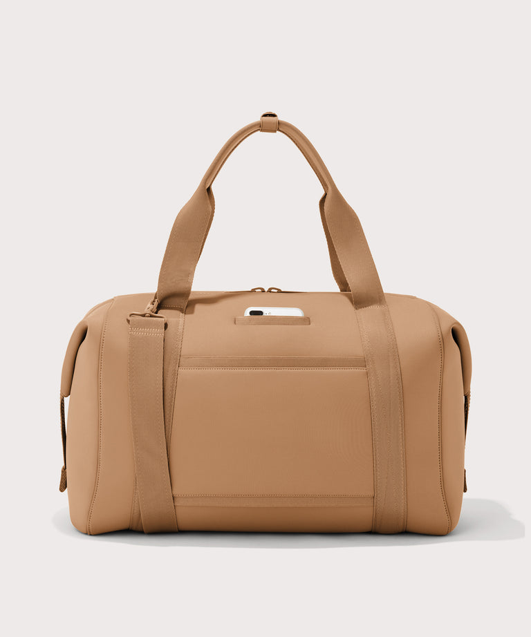 Extra large Landon Carryall in camel brown, displaying an exterior phone pocket
