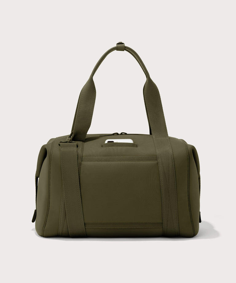 Large Landon Carryall in dark green, displaying an exterior phone pocket
