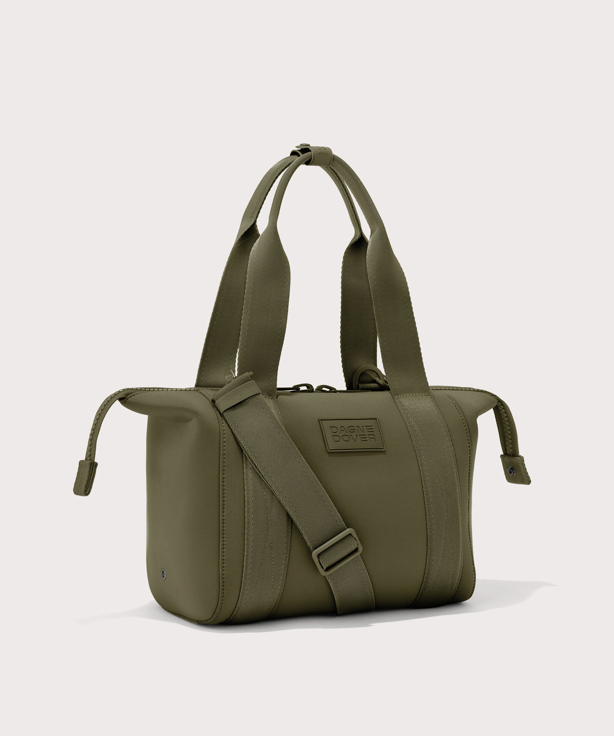 small Landon Carryall in dark green with zippers unbuckled
