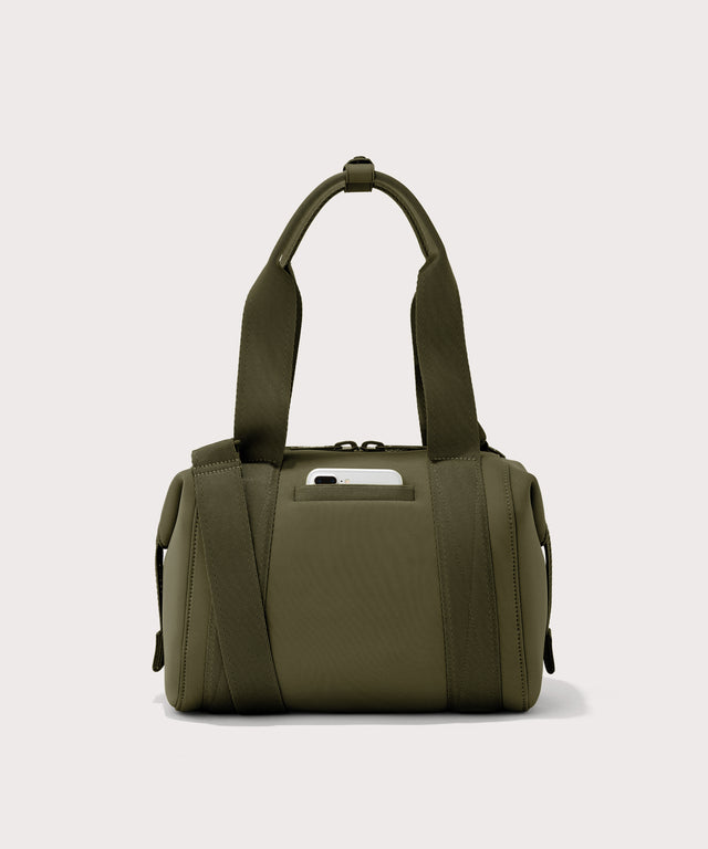 small Landon Carryall in dark green, displaying an exterior phone pocket
