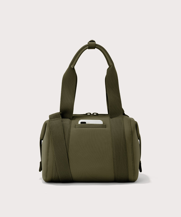 small Landon Carryall in dark green, displaying an exterior phone pocket
