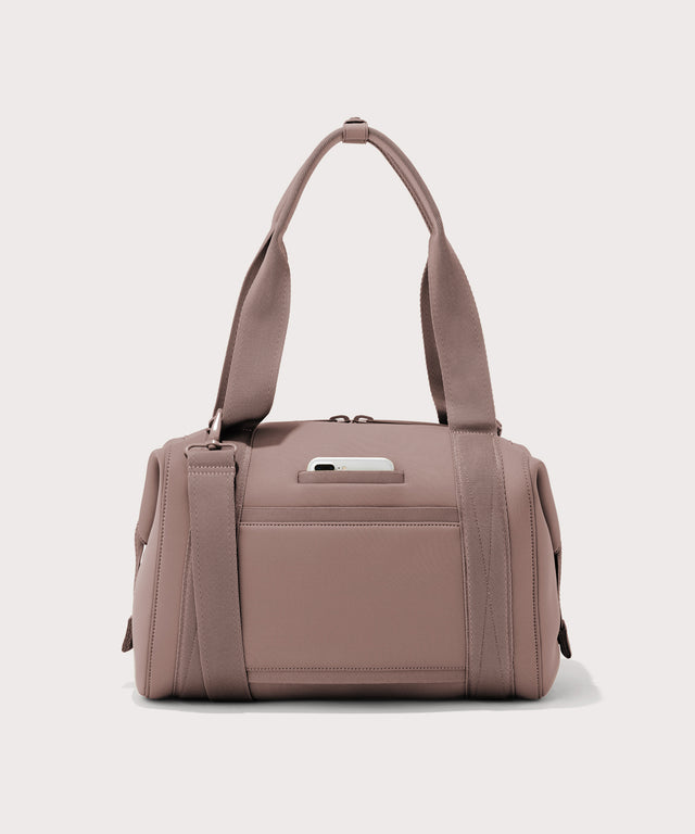 Large Landon Carryall in pink, displaying an exterior phone pocket
