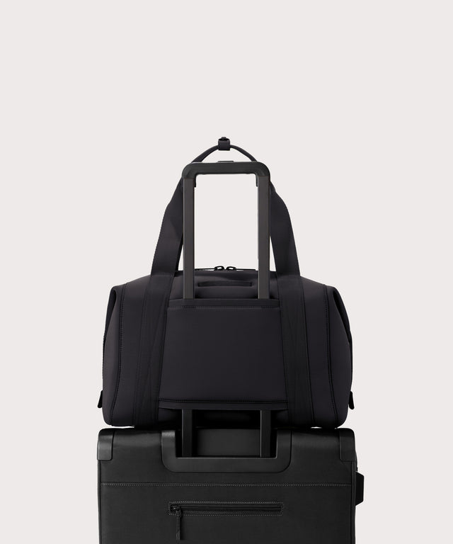 Large Landon Carryall in black displaying luggage sleeve
