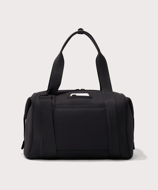 Large Landon Carryall in black, displaying an exterior phone pocket

