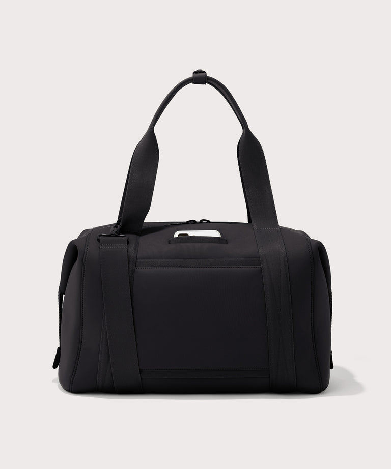 Large Landon Carryall in black, displaying an exterior phone pocket

