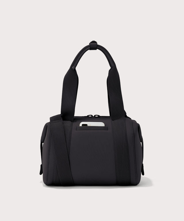 small Landon Carryall in black, displaying an exterior phone pocket
