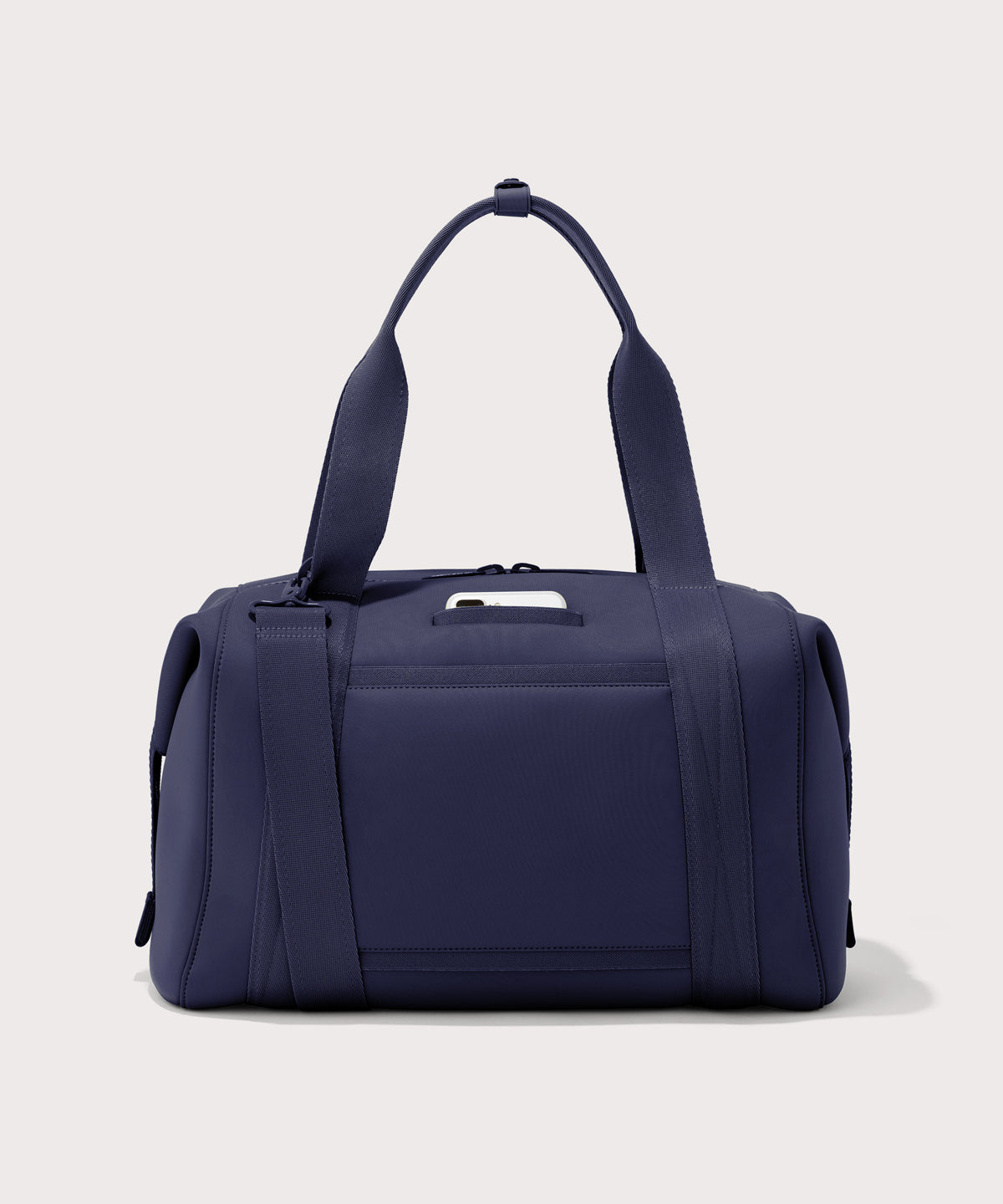 Large Landon Carryall in navy blue, displaying an exterior phone pocket
