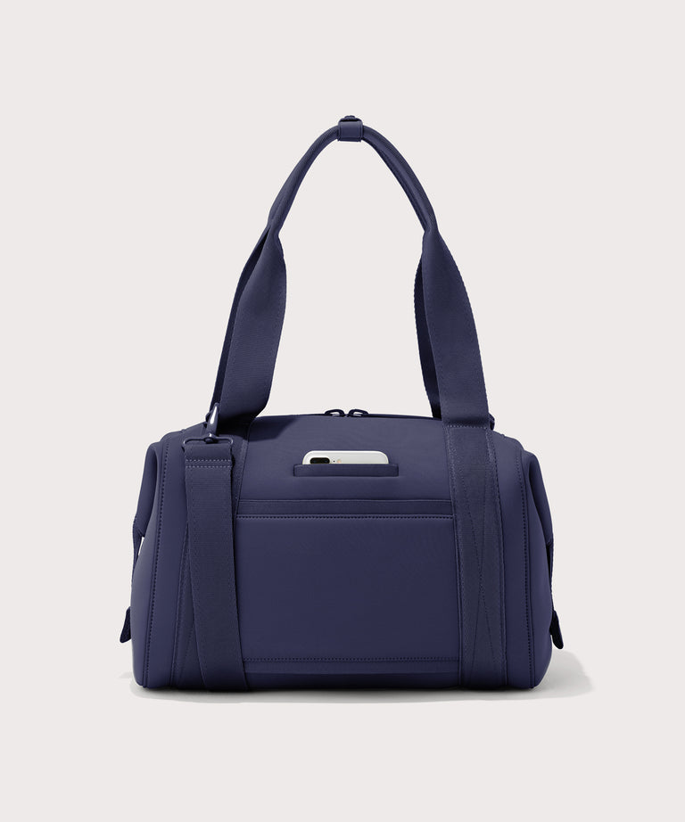Large Landon Carryall in dark blue, displaying an exterior phone pocket
