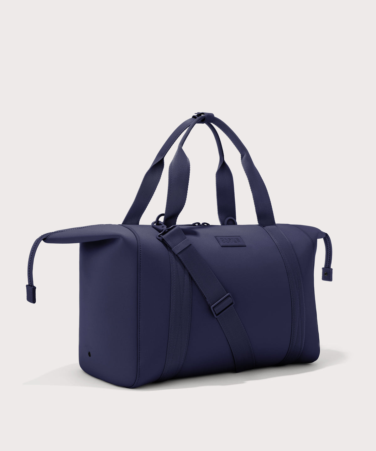 Extra large Landon Carryall in dark blue with zippers unbuckled
