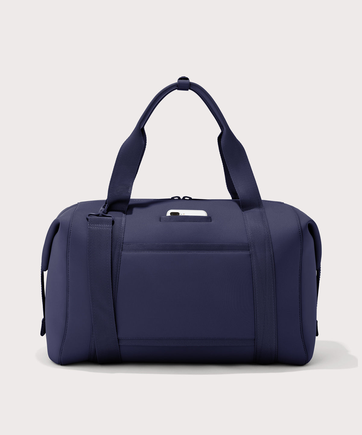 Extra large Landon Carryall in dark blue, displaying an exterior phone pocket
