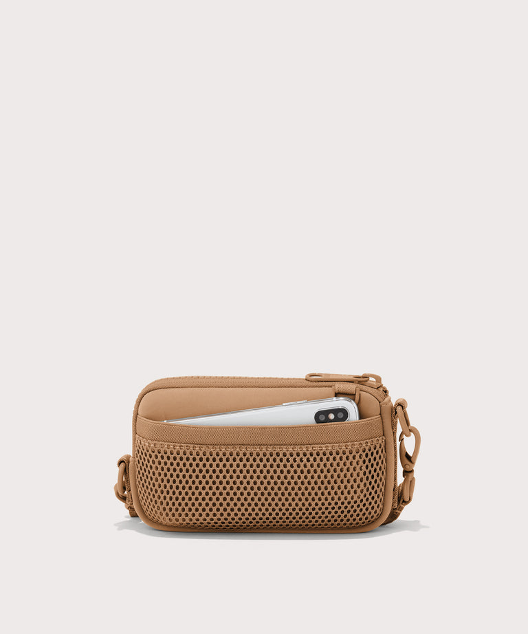 Dagne Dover Mara Phone Sling in brown camel showing the exterior air mesh slip.
