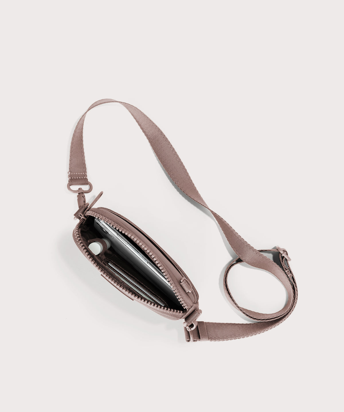 Dagne Dover Mara Phone Sling unzipped in pink seen from above, exposing the interior card slots.