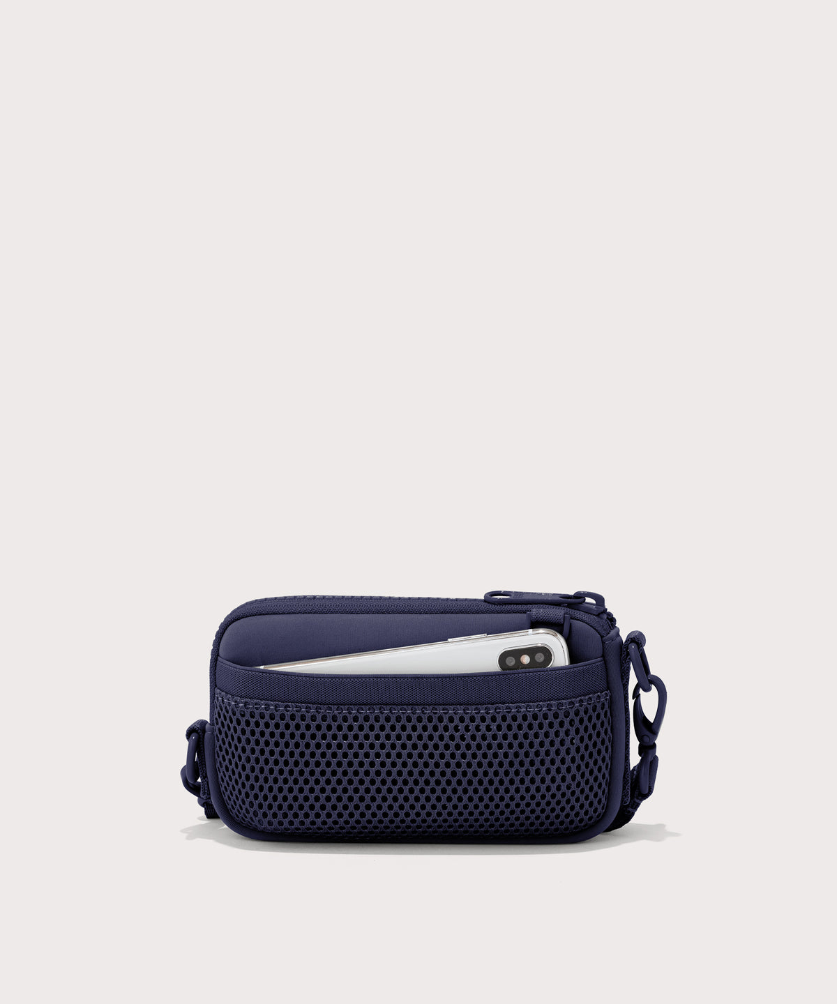 Dagne Dover Mara Phone Sling in dark blue showing the exterior air mesh slip.
